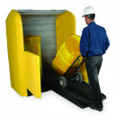 man with dolly rolling drum up loading ramp into hard top storage